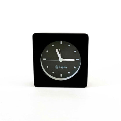 Bagby MINIMALIST Silent Alarm Clock on modern nightstand next to bed in contemporary bedroom