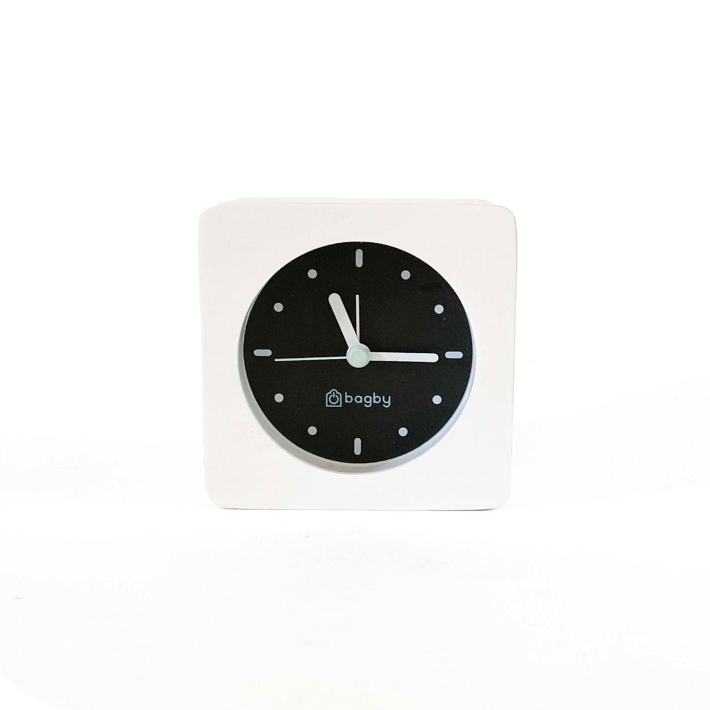 Bagby MINIMALIST alarm clock with backlight activated showing illuminated face in dark room