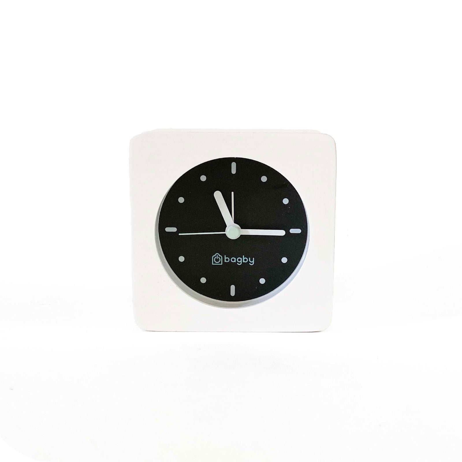 Bagby MINIMALIST alarm clock with backlight activated showing illuminated face in dark room
