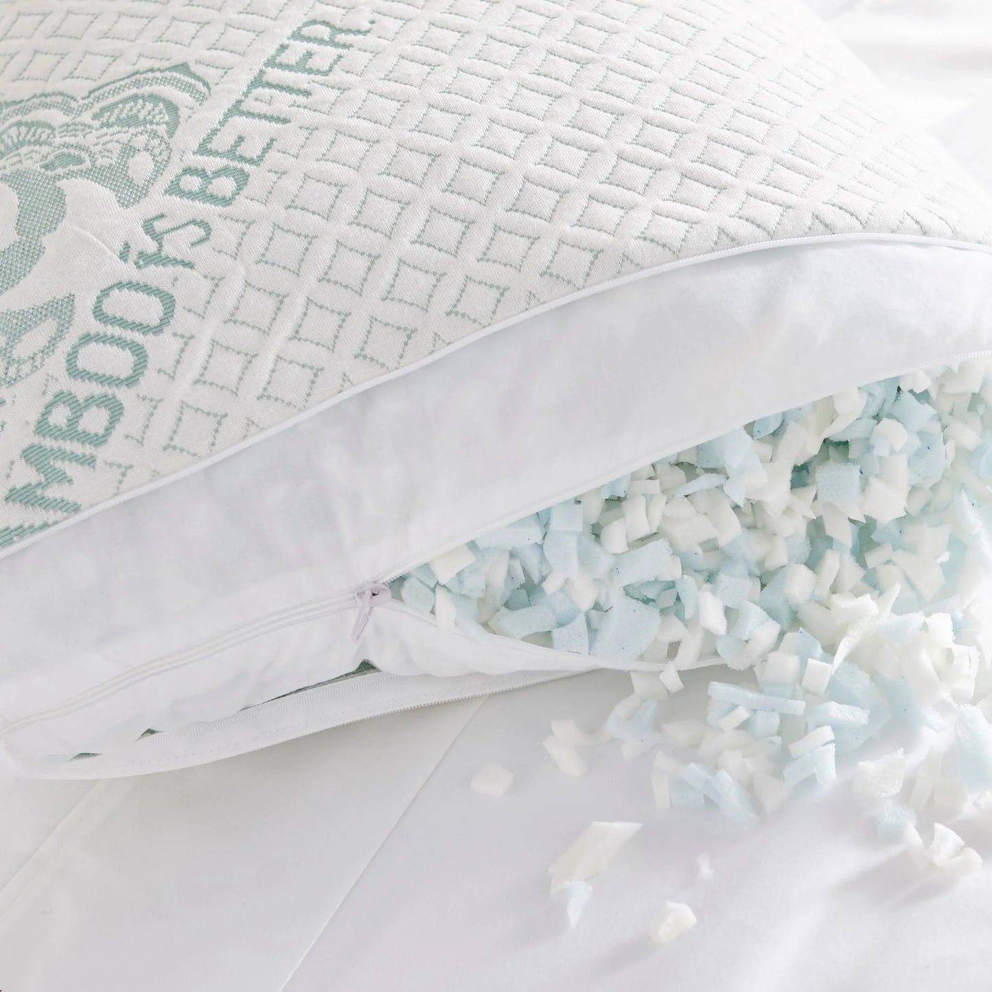 Person sleeping on side using Adjustable Bamboo Cooling Pillow on white bedding