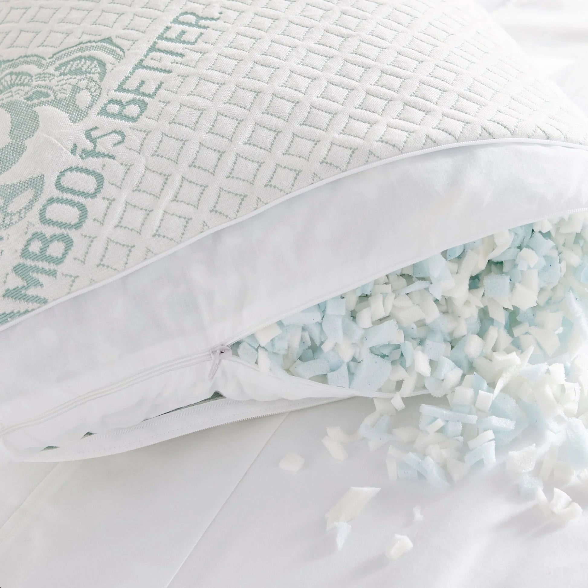 Person sleeping on side using Adjustable Bamboo Cooling Pillow on white bedding