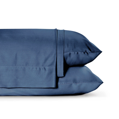 Bamboo viscose sheets on bed in bedroom setting showing smooth sateen finish and deep pocket fitted sheet